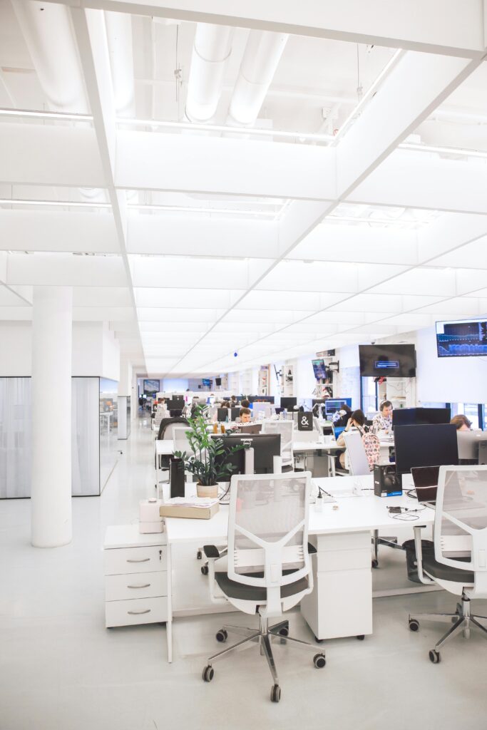 White Plastic Chairs and Tables in White Room